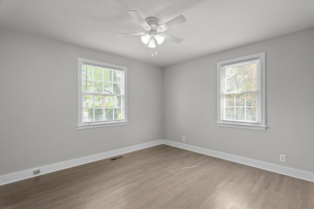 2638 Central Ave, Augusta, GA 30904 - unfurnished room with baseboards, visible vents, wood finished floors, and plenty of natural light