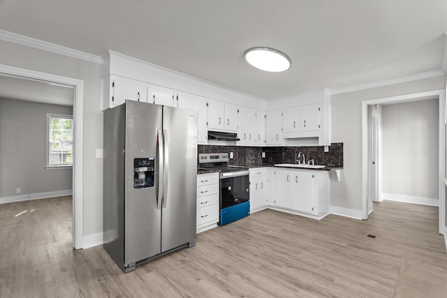 2638 Central Ave, Augusta, GA 30904 - kitchen with a sink, stainless steel appliances, tasteful backsplash, white cabinetry, and light wood-style flooring