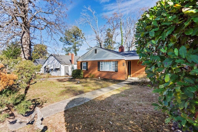 ranch-style home with a front yard