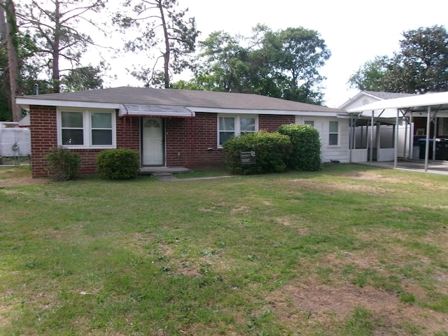 2524 Elderberry Dr, Augusta, GA 30906 - ranch-style house featuring a front lawn, brick siding, and a sunroom