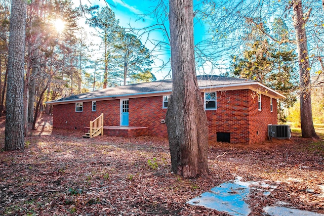 back of house featuring cooling unit