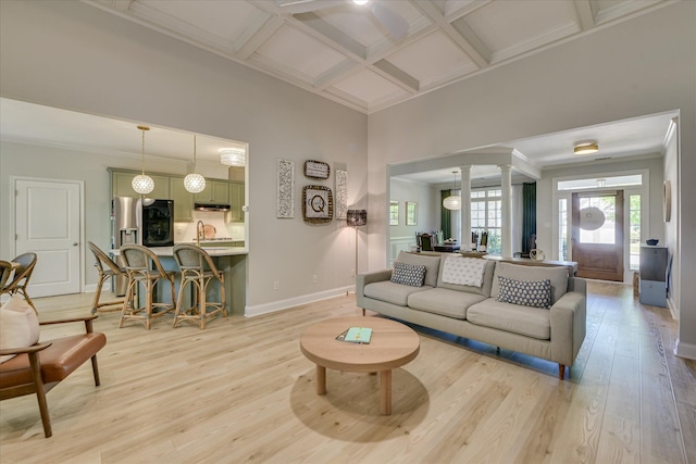421 Armstrong Way, Evans, GA 30809 - living area with ornate columns, light wood finished floors, baseboards, coffered ceiling, and ornamental molding