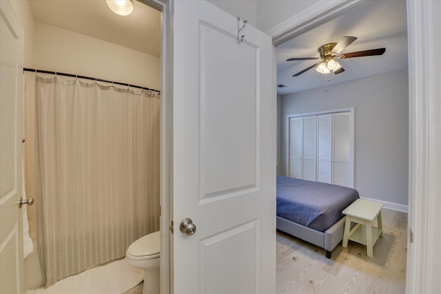 421 Armstrong Way, Evans, GA 30809 - full bathroom with wood finished floors, toilet, a ceiling fan, baseboards, and curtained shower