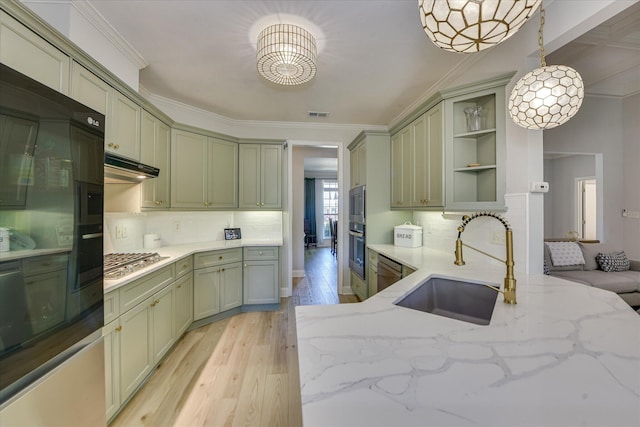 421 Armstrong Way, Evans, GA 30809 - kitchen featuring a sink, open shelves, green cabinetry, light wood-style flooring, and stainless steel appliances