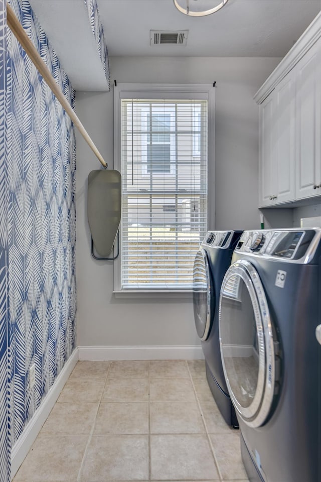 421 Armstrong Way, Evans, GA 30809 - washroom with cabinet space, separate washer and dryer, light tile patterned floors, and baseboards