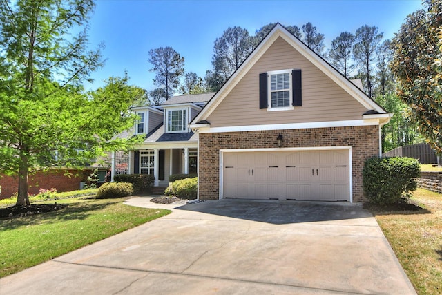 421 Armstrong Way, Evans, GA 30809 - traditional-style house with brick siding, driveway, a front lawn, and an attached garage
