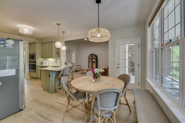 421 Armstrong Way, Evans, GA 30809 - dining space featuring plenty of natural light, light wood-style floors, and ornamental molding