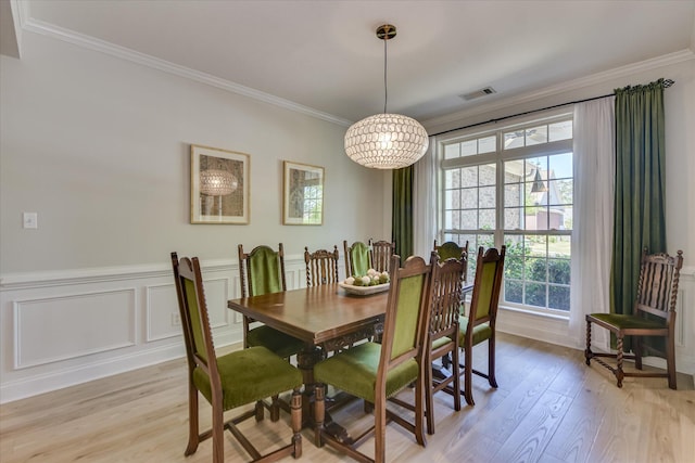 421 Armstrong Way, Evans, GA 30809 - dining room with light wood-style flooring, crown molding, plenty of natural light, and wainscoting