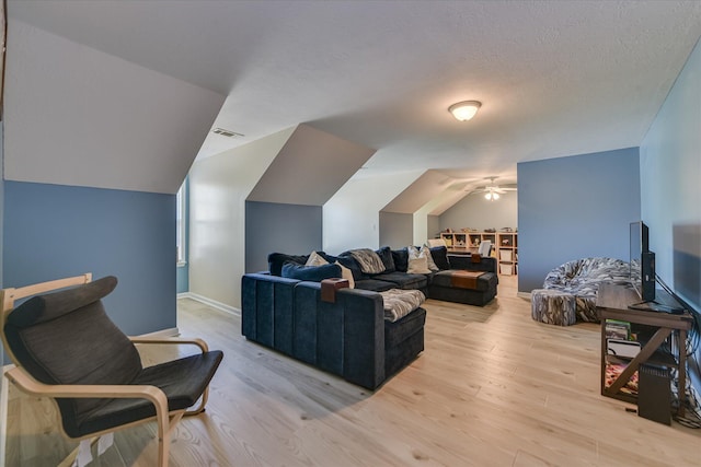 421 Armstrong Way, Evans, GA 30809 - living room with ceiling fan, light wood-style flooring, lofted ceiling, and a textured ceiling