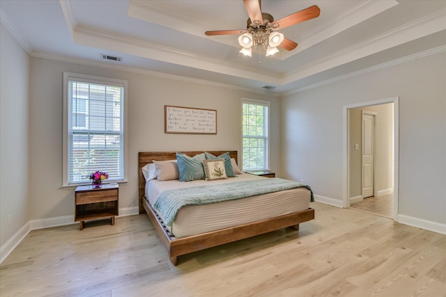 421 Armstrong Way, Evans, GA 30809 - bedroom featuring a raised ceiling, light wood-style floors, ornamental molding, and baseboards