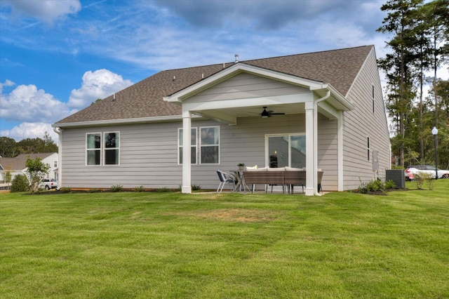 rear view of property featuring central AC unit, ceiling fan, an outdoor hangout area, and a lawn