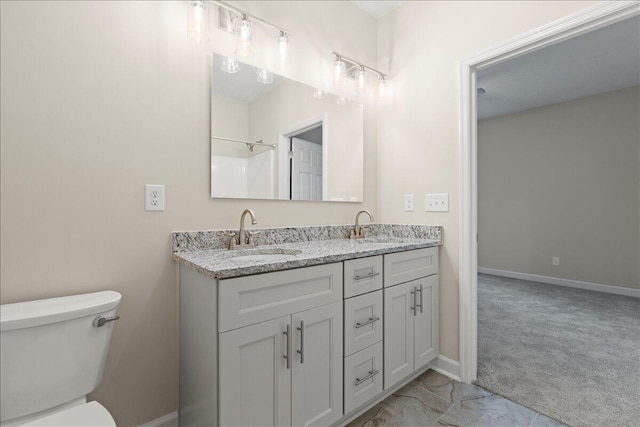 239 Walker St, Augusta, GA 30901 - full bathroom featuring double vanity, toilet, and baseboards
