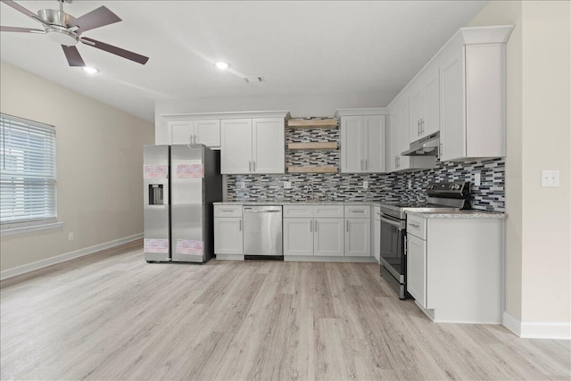 239 Walker St, Augusta, GA 30901 - kitchen with stainless steel appliances, light wood finished floors, under cabinet range hood, decorative backsplash, and recessed lighting