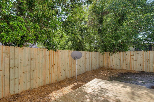 view of patio with a fenced backyard and a wooden deck