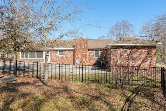 back of house with a yard