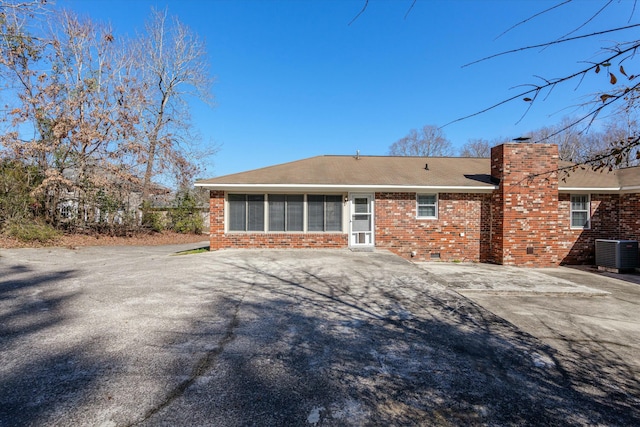 back of property with central AC