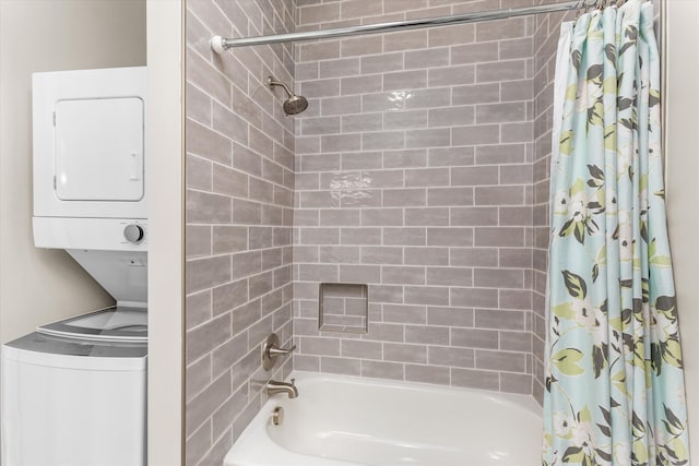 bathroom with stacked washer and dryer and shower / tub combo