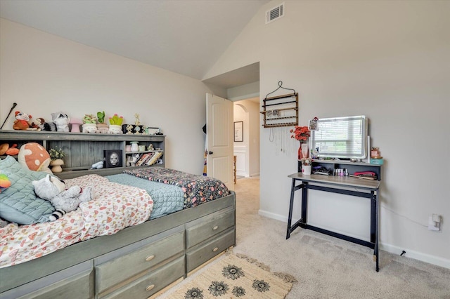 bedroom featuring light carpet and vaulted ceiling