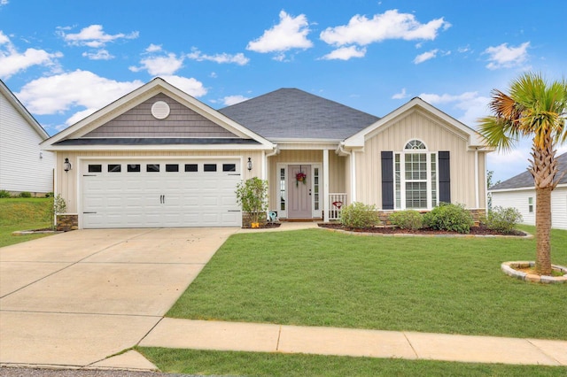 view of front of property featuring a front yard and a garage