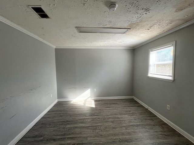 empty room featuring a textured ceiling, dark hardwood / wood-style floors, and ornamental molding