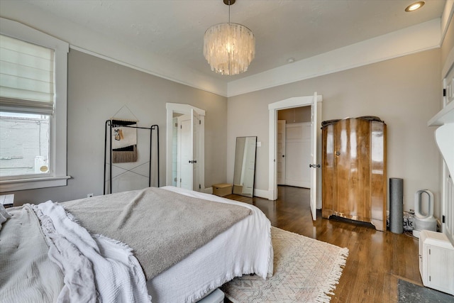 1202 Hickman Rd, Augusta, GA 30904 - bedroom with wood finished floors and a chandelier