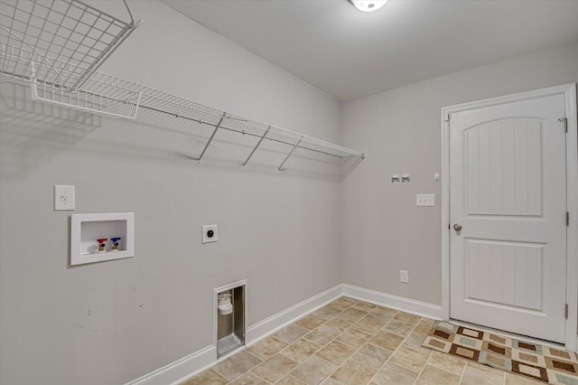 laundry room featuring baseboards, hookup for an electric dryer, laundry area, washer hookup, and stone finish floor