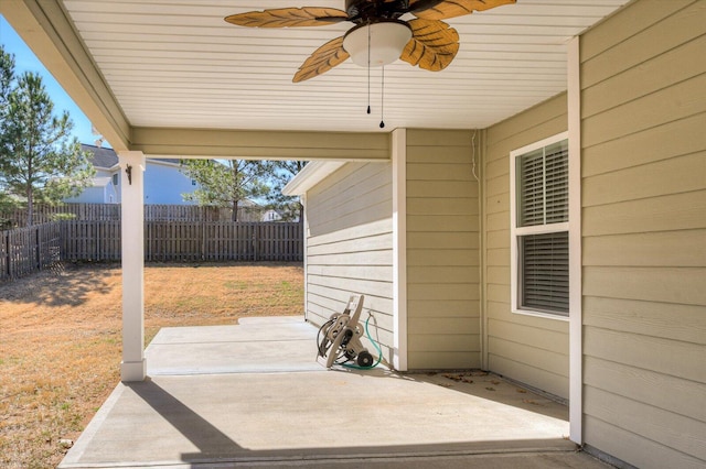 view of patio with a ceiling fan and fence