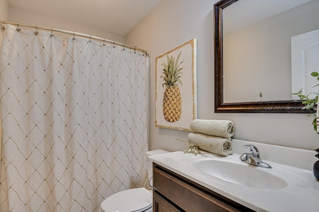 bathroom featuring vanity, toilet, and a shower with curtain