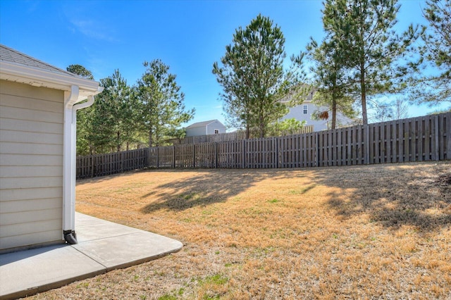 view of yard with a fenced backyard