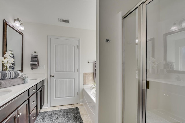 bathroom featuring visible vents, a shower stall, tile patterned flooring, double vanity, and a bath