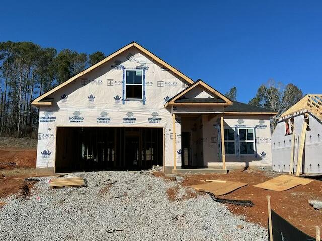 unfinished property featuring a garage