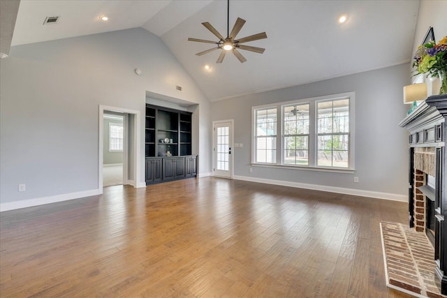 951 Napiers Post Dr, Evans, GA 30809 - unfurnished living room with a fireplace, a ceiling fan, high vaulted ceiling, healthy amount of natural light, and hardwood / wood-style flooring