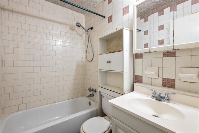 full bathroom with tasteful backsplash, tile walls, tiled shower / bath combo, vanity, and toilet