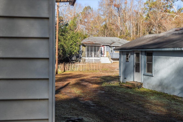 view of yard featuring a sunroom