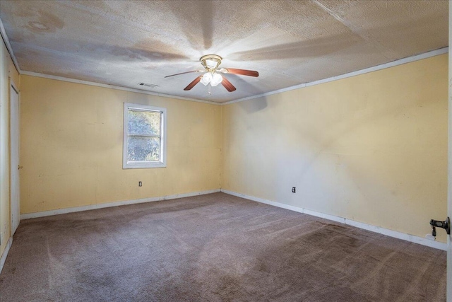 empty room with ceiling fan, ornamental molding, carpet, and a textured ceiling