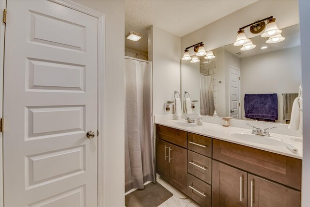 full bath featuring double vanity and a sink