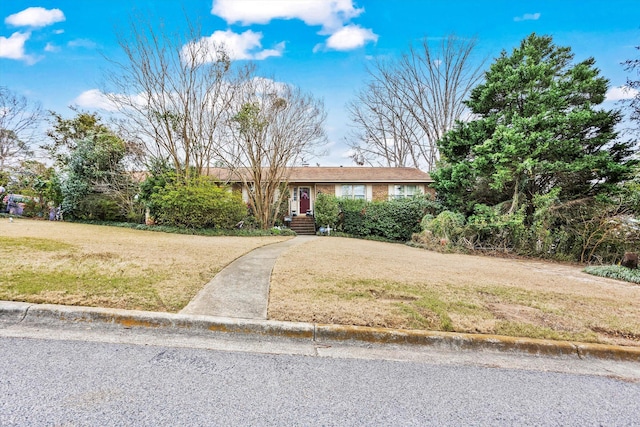 ranch-style home with a front yard