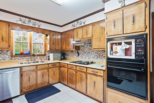 kitchen featuring light countertops, under cabinet range hood, and stainless steel dishwasher