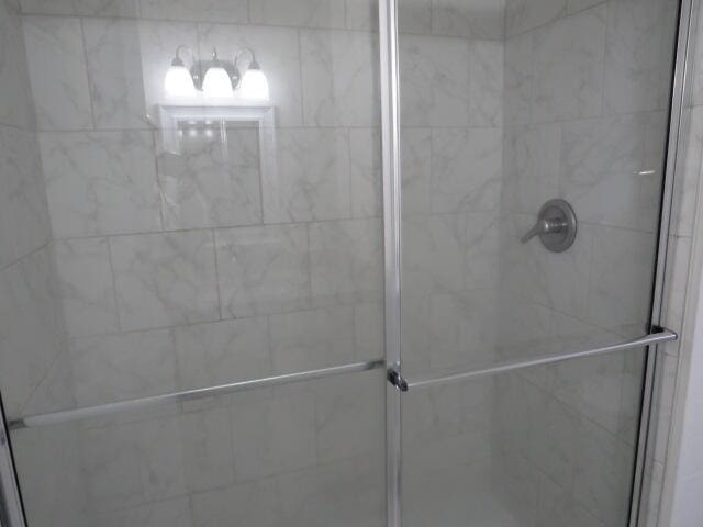 bathroom featuring an enclosed shower