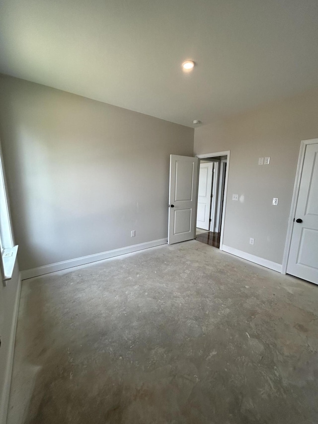410 Williams St, Grovetown, GA 30813 - unfurnished bedroom with unfinished concrete flooring and baseboards