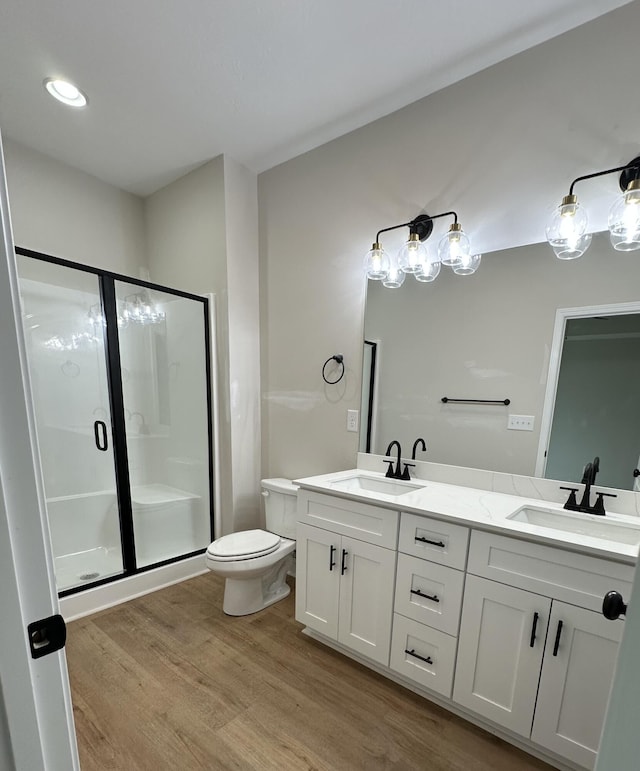 410 Williams St, Grovetown, GA 30813 - bathroom featuring wood finished floors, a shower stall, double vanity, and toilet