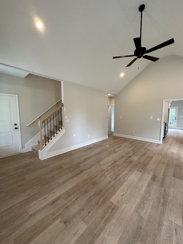 410 Williams St, Grovetown, GA 30813 - unfurnished living room with stairway, lofted ceiling, ceiling fan, light wood-style floors, and baseboards