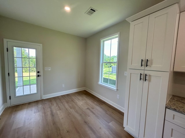 410 Williams St, Grovetown, GA 30813 - unfurnished dining area featuring wood finished floors, plenty of natural light, and baseboards