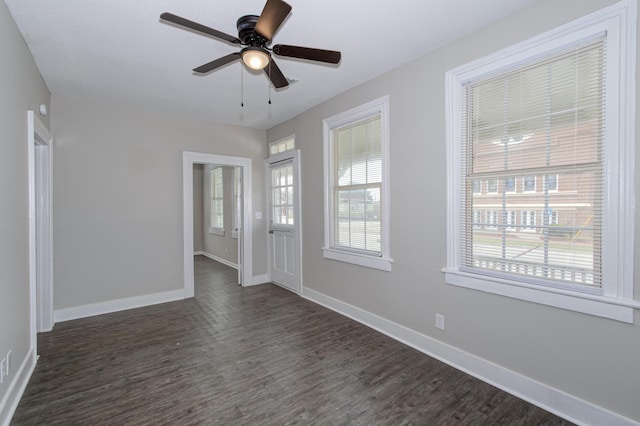 interior space featuring ceiling fan and dark wood-type flooring