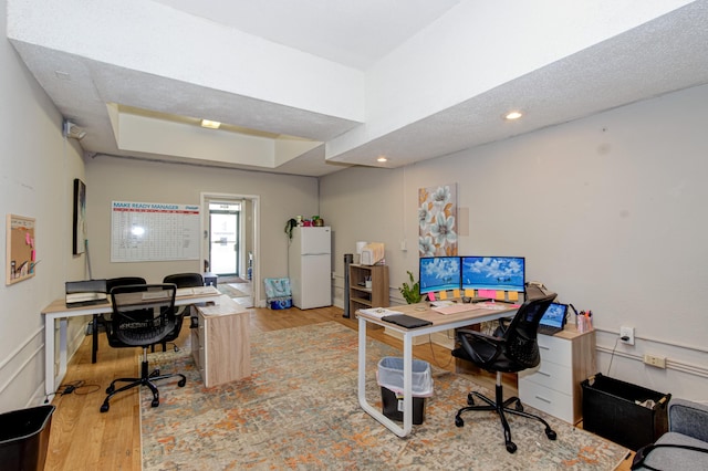 office with light hardwood / wood-style flooring