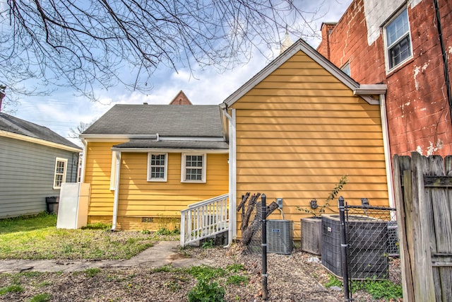 back of property with central AC unit