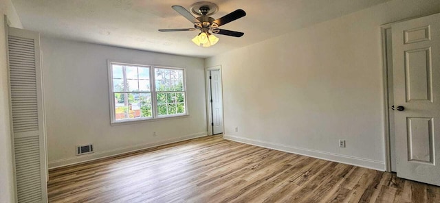 1306 Dominica Dr, Augusta, GA 30909 - unfurnished bedroom with wood finished floors, baseboards, a closet, and a ceiling fan
