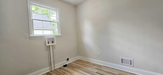 1306 Dominica Dr, Augusta, GA 30909 - washroom featuring hookup for a washing machine, baseboards, and light wood finished floors