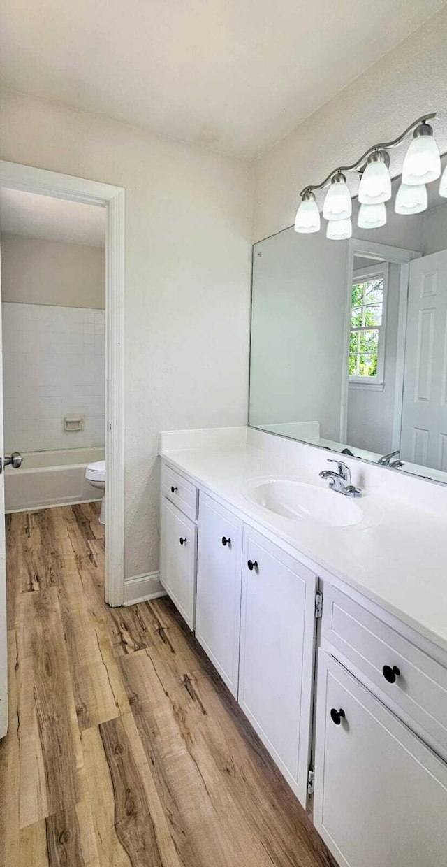 1306 Dominica Dr, Augusta, GA 30909 - bathroom featuring vanity, wood finished floors, and toilet