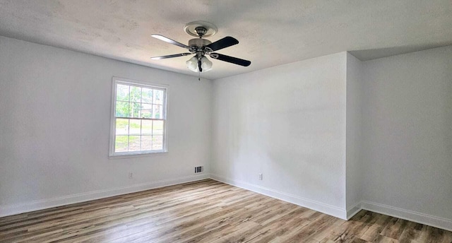 1306 Dominica Dr, Augusta, GA 30909 - unfurnished room with wood finished floors, baseboards, a ceiling fan, and a textured ceiling